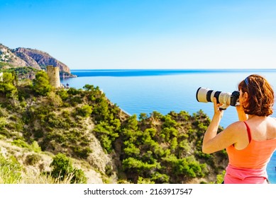 Tourist Woman With Camera Taking Travel Photo From Seaside Cliff, Mediterranean Coastal Landscape. Summer Holiday Trip.