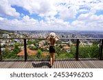 Tourist woman enjoying cityscape of Belo Horizonte, Minas Gerais, Brazil