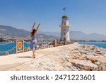 Tourist woman near lighthouse in Alanya, Antalya district, Turkey