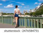 Tourist woman and Notre-Dame de Paris and Seine, Paris, France, Europe