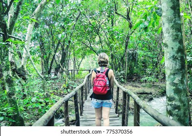 Tourist Woman On A Eco Tour Walking Through A Path Walk On The Forest. Trail Surrounded By Nature On Bonito - MS, Brazil.