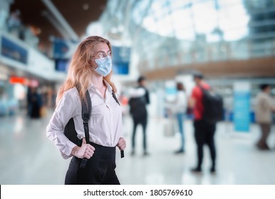 Tourist Woman With Protection Face Mask at The Airport Terminal in Coronavirus Covid-19 Pandemic, Defensive Measure for Travel Restrictions of Tourist During Covid 19 Outbreak. Healthcare/Medical