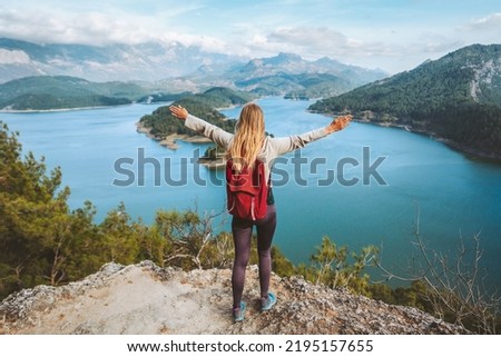 Tourist woman raised hands enjoying lake view outdoor Travel in Turkey adventure trip active vacations healthy lifestyle eco tourism girl hiking solo