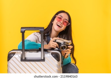 Tourist woman in summer casual clothes.Asian Smiling woman .Passenger traveling abroad to travel on yellow colour background.Asian woman going to summer vacation.Travel trip funny.