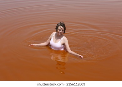 Tourist Woman Swimming. Lake Retba, Lac Rose, Senegal, Africa. Senegalese Landscape, Scenery. African Landmark. Nature, Lake Retba, Lac Rose In Senegal. Swim Woman. Tourism, Travel In Senegal, Africa