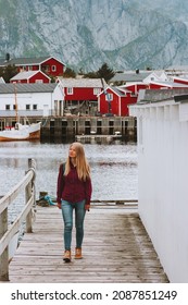 Tourist Woman Walking Sightseeing Lofoten Islands Village In Norway Travel Lifestyle Outdoor Summer Vacations Trip Scandinavian Culture