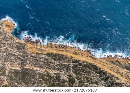 Similar – Aerial Drone View Of Dramatic Ocean Waves Crushing On Rocky Landscape