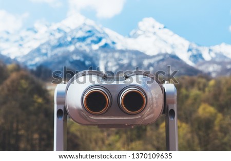 touristic telescope look at the city with view snow mountains, closeup binocular on background viewpoint observe vision, metal coin operated in panorama observation, travel nature concept