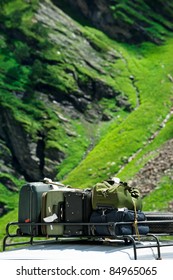 Tourists Baggage On Car Trunk Over Mountains Landscape