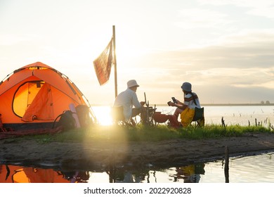 Tourists camping tent.Young charming couple in love playing .Relaxing with nature,lifestyle concept.