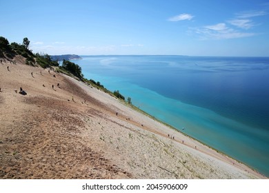 Tourists climbing steep sand dunes at Sleeping Bear Dunes National Lakeshore, Michigan