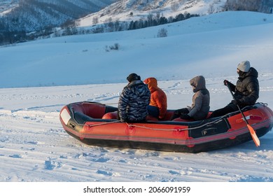 Tourists Do Snow Rafting At Sunny Day. Altai Republic, Siberia, Russia.