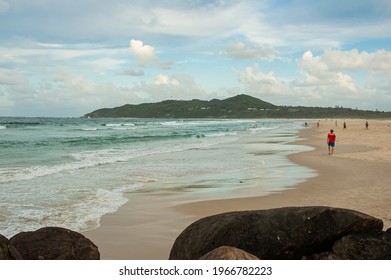 Tourists enjoying Main Beach of Byron Bay, a popular tourist destination in New South Wales, Australia.