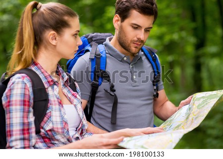 Image, Stock Photo ourist standing on a swinging bridge surrounded by rainforest