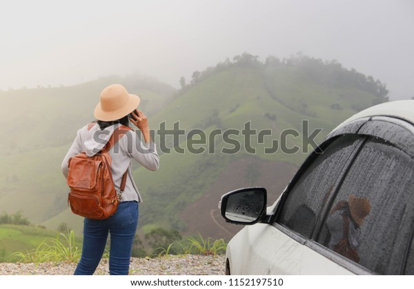 The tourists happy woman,. Leisure holidays on a\
mountain in the fog.