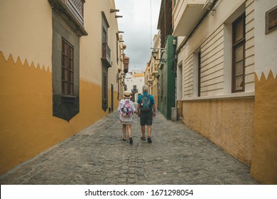 Tourists Older Couple Walking On The Street