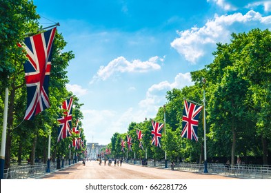 Tourists on The Mall as flags line the famous avenue, London