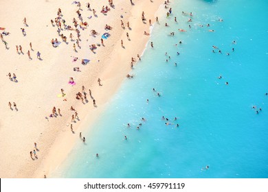 Tourists on the sand beach of Navagio Zakynthos Greece. - Powered by Shutterstock