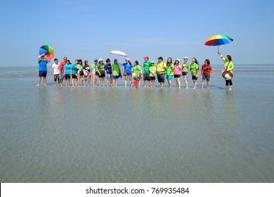 Tourists On Sasaran Sky Mirror Flat Salt Sandy Atoll Islet In Preparation To Pose For A Remembrance Photo Image At Kuala Selangor, Malaysia - May 28, 2017 