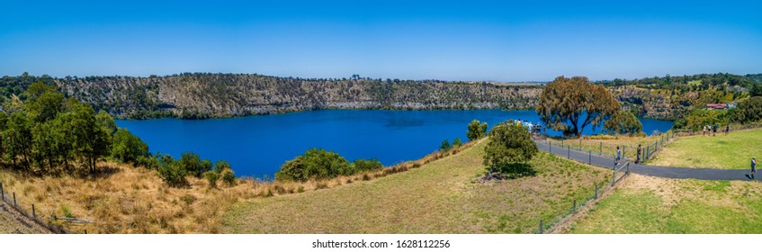 Tourists on viewing platform at the Blue Lake in Mount Gambier, South Australia - wide aerial panorama