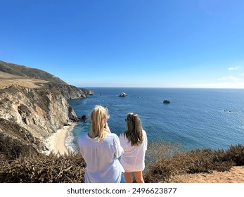 Tourists overlooking coastline at Bixby Creek Bridge, Monterey, CA   - Powered by Shutterstock