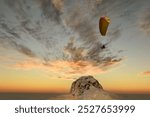 Tourists paragliding at Leh Ladakh with view of Himalayan mountain range.