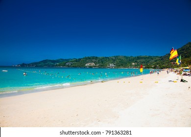 Tourists at Patong beach in Phuket, Thailand. Phuket is a popular destination famous for its beaches.