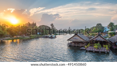 Tourists restaurants on the floating house rafting at the river Kwai, Kanchanaburi, Thailand