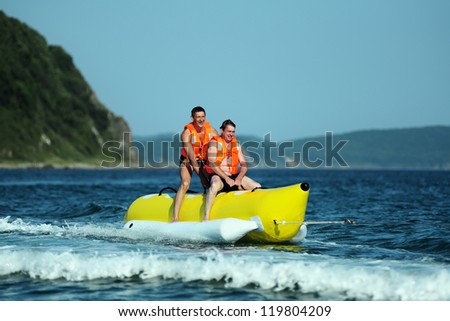 Tourists ride a Banana Boat