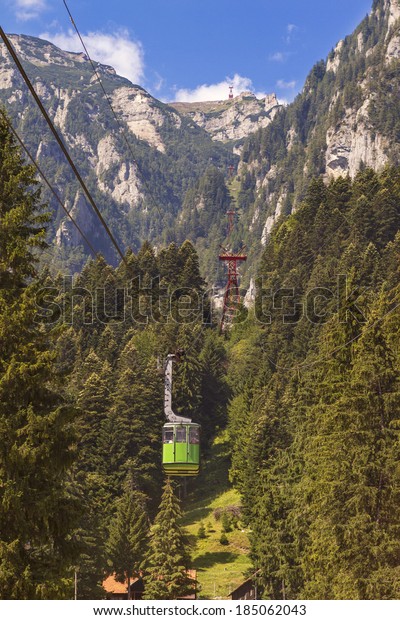 tourists ride the cable\
car