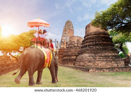 Tourists riding elephants in Ayutthaya,Thailand sunrise,sun light