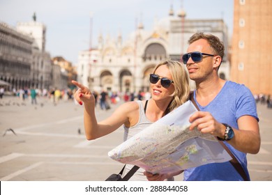 Tourists Sightseeing In Venice