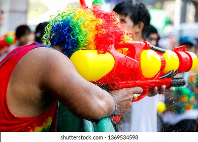 Tourists Are Splashing Water Guns At Songkran Festival In Silom, One Of The Most Popular Water Fight Places During Songkran In Bangkok, Thailand.