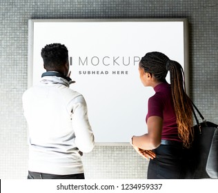 Tourists standing by a led sign mockup