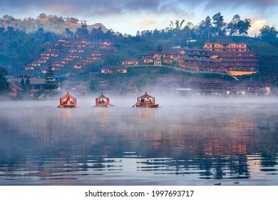 Tourists take a boat at Ban Rak Thai village in Mae Hong Son province, Thailand. - Shutterstock ID 1997693717