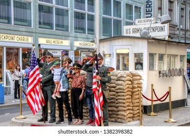 Tourists Take Photos At Checkpoint Charlie Located In The Kreuzberg District On Friedrichstraße In Berlin, Germany - 21/04/2019