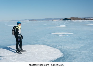 Tourists Travel To Norway Hiking Ice Skating On The Frozen Lake. Special Long Skate For Long Distances. Mounting Under The Ski Boots. Location Of Lake Baikal Action. The Russian Called Bayes Or Loft.