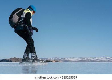 Tourists Travel To Norway Hiking Ice Skating On The Frozen Lake. Special Long Skate For Long Distances. Mounting Under The Ski Boots. Location Of Lake Baikal Action. The Russian Called Bayes Or Loft.