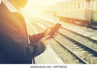 Tourists Travelers ,business Man Consulting Gps And Guide From Smart Phone In A Train Station,Hand Holding Smartphone With Subway Map Application,checking Message Sms E-mail Or Train Schedule,vintage