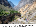 Tourists are trekking in Colca Canyon valley along Colca River - Arequipa, Peru