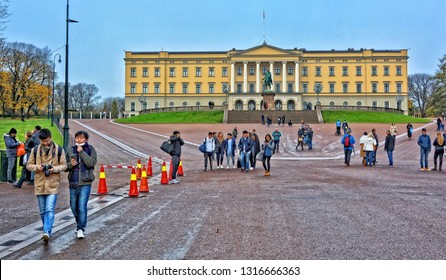 Tourists Visit The Royal House Of Norway. Sightseeing. Statue Of King Karl Johan In Front Of Royal Palace In Oslo. Official Residence Of Norwegian Monarch. Norway, Oslo – November 4, 2017