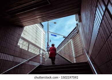 Tourists Walking Up The Stairs From The Korean Subway