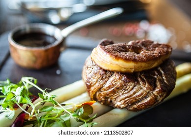 Tournedos Rossini. Foie Gras, Black Angus Beef Tenderloin, White Asparagus, Red Wine Sauce. Delicious Healthy Traditional Food Closeup Served For Lunch In Modern Gourmet Cuisine Restaurant