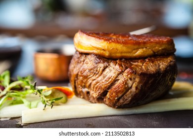 Tournedos Rossini. Foie Gras, Black Angus Beef Tenderloin, White Asparagus, Red Wine Sauce. Delicious Healthy Traditional Food Closeup Served For Lunch In Modern Gourmet Cuisine Restaurant