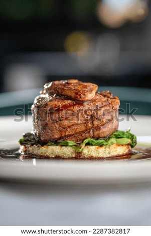 Tournedos Rossini. Foie gras, Black Angus beef tenderloin, with red wine sauce. Fillet mignon steak with Foie Gras. Serving in the restauran.