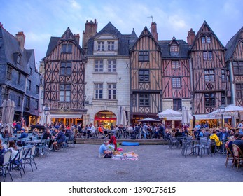 Tours, France - April 17, 2019: View of Plumereau square in medieval city of Tours. Capital of the Indre et Loire department. People on the terraces enjoying the day