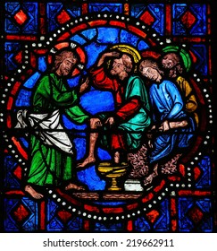 TOURS, FRANCE - AUGUST 8, 2014: Stained glass window depicting Jesus washing the feet of Saint Peter at the Last Supper on Maundy Thursday in the Cathedral of Tours, France.