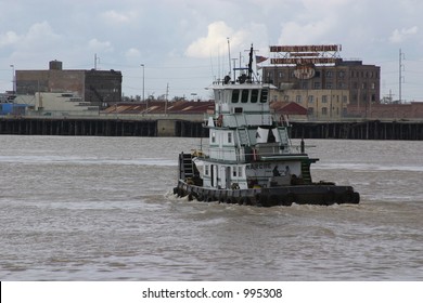 Tow Boat Heading Up River In The Port Of New Orleans.