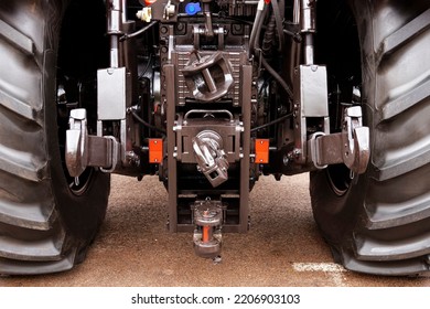 Tow Hitch Of A Modern Tractor With Safety And Insurance Locks. Selective Focus