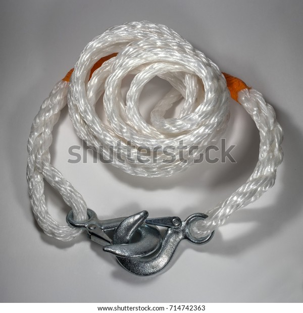 A tow rope\
with hooks on a light\
background.